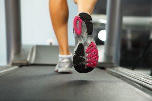 27199399 - image of female foot running on treadmill