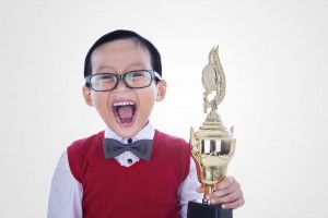 shutterstock_189390395 - happy child award trophy